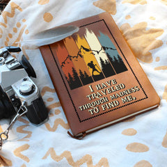 Havijo "Traveled to Find Me" journal with a textured cover, open to pages, as a personal travel accessory.
