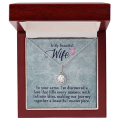 Havijo "In My Wife's Arms" eternal hope necklace showcasing a delicate silver pendant with engraved design.