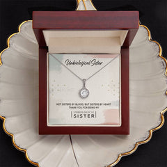 Havijo Unbiological Sister Eternal Hope Necklace featuring a delicate pendant on a silver chain, showcasing meaningful jewelry design.