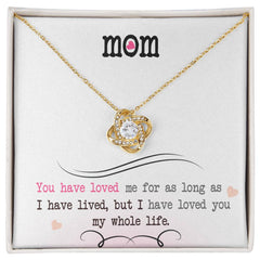 Havijo Love Knot Necklace with intertwined silver and gold-toned jewelry, showcasing the elegant design and craftsmanship.