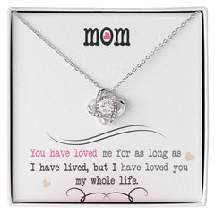 Havijo Love Knot Necklace featuring a delicate intertwined design on a silver chain, showcasing elegant jewelry craftsmanship.