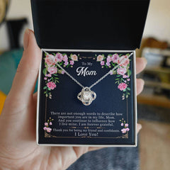 Havijo Forever Grateful Love Knot Necklace jewelry with a delicate intertwined knot pendant on a chain.