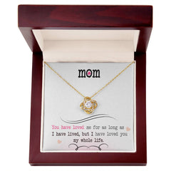 Havijo Love Knot Necklace featuring intertwined silver jewelry design, close-up of the elegant love knot pendant.