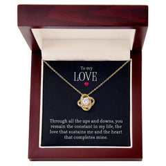 Havijo Love Knot Necklace with heart-shaped pendant, elegant jewelry piece symbolizing love and connection.
