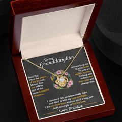 Havijo Keep Me In Your Heart love knot necklace with a delicate silver chain and a heart-shaped pendant featuring a love knot design.
