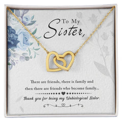 Havijo To My Sister interlocking hearts necklace featuring a silver chain and two heart pendants symbolizing sisterly love.