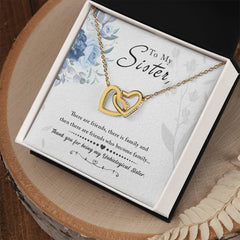 Havijo To My Sister interlocking hearts necklace in silver, featuring two connected heart pendants on a delicate chain.
