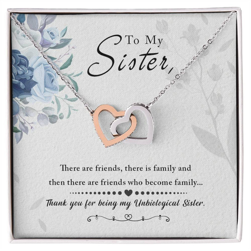Havijo To My Sister interlocking hearts necklace featuring silver jewelry with two heart pendants symbolizing love and connection.