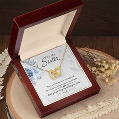 Havijo To My Sister interlocking hearts necklace, silver jewelry with two connected heart pendants symbolizing love and bond.