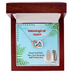 Havijo Best Friends interlocking hearts necklace, jewelry with two connected heart pendants, displayed on a neutral background.