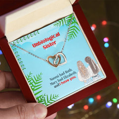 Havijo Best Friends interlocking hearts necklace with two silver heart pendants linked together, symbolizing friendship and love.