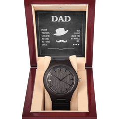 Havijo Dad's Love wooden watch with a brown leather strap and round wooden face, showcasing elegant jewelry craftsmanship.