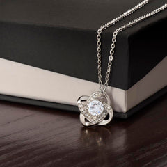 Havijo Love Knot Necklace made of silver with a delicate intertwined design, displayed on a neutral background.