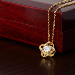 Havijo Love Knot Necklace featuring a delicate intertwined design in silver, showcasing elegant jewelry craftsmanship.