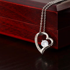 Havijo Forever Love Necklace featuring intertwined heart-shaped pendants in silver jewelry style.