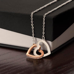 Havijo interlocking hearts necklace featuring two silver heart pendants connected on a delicate chain, jewelry accessory for women