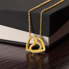 Havijo interlocking hearts necklace with silver-tone jewelry featuring two connected heart pendants.