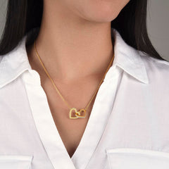 Havijo interlocking hearts jewelry necklace with two silver heart pendants linked together, elegant and romantic design.