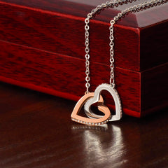 Havijo interlocking hearts jewelry necklace featuring two connected heart pendants on a delicate chain.