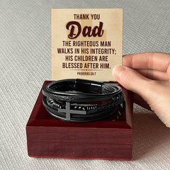 Leather cross bracelet with Proverbs 20:7 inscription, handcrafted jewelry by Havijo featuring a religious-inspired design.