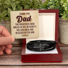 Leather cross bracelet with Proverbs 20:7 inscription, religious jewelry by Havijo featuring a sleek, handcrafted design.