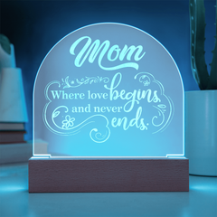 Havijo Mom's Love dome plaque jewelry featuring a heartfelt design with intricate details on a polished metal surface.