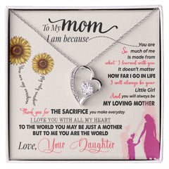 Havijo You Are My Sunshine Forever Love Necklace with a delicate pendant resting on a jewelry display.