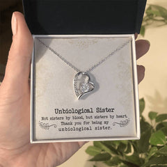 Havijo Unbiological Sister Forever Love Necklace, delicate jewelry with a meaningful pendant, on a neutral background.
