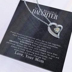 Havijo My Beautiful Daughter Forever Love Necklace featuring a delicate pendant, displayed on a soft fabric background.