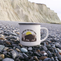 Havijo Fluffy Cows camping mug with colorful cow design, featuring a cozy, whimsical illustration on a ceramic mug.