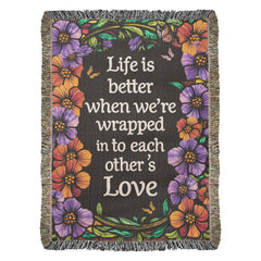 Havijo "Life is Better With You" heirloom blanket draped over a cozy armchair, showcasing soft, textured fabric and elegant design.